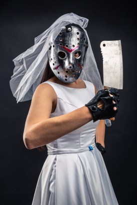 Bride in hockey mask with meat cleaver